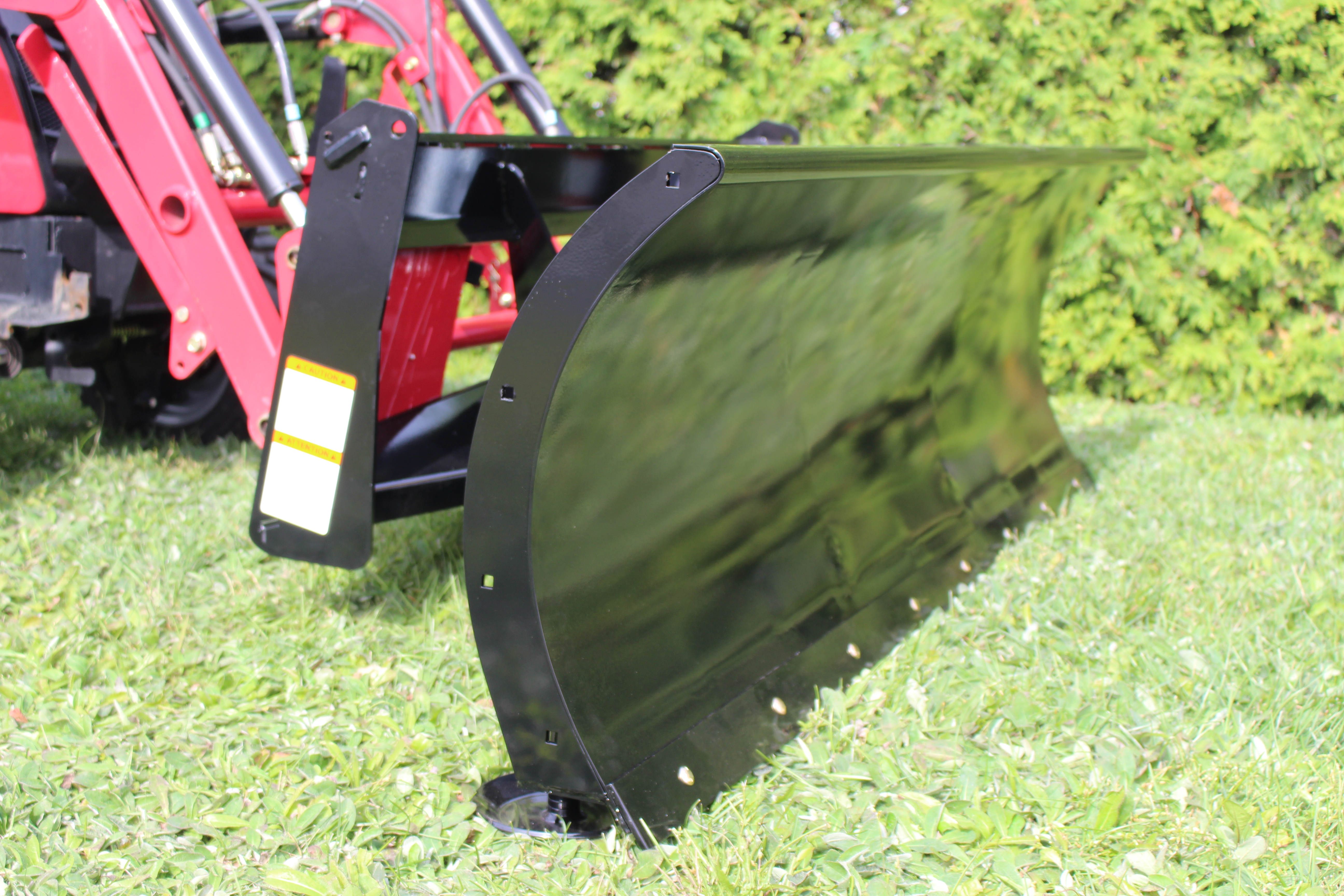 Close-up of 22 inch high curved Bercomac snow blade